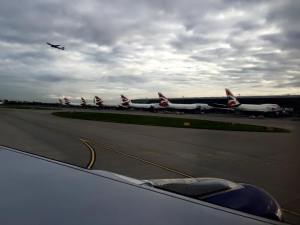 747-400s at Heathrow with 777 taking off in the background.