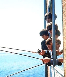 The Beatles fishing from their room at The Edgewater